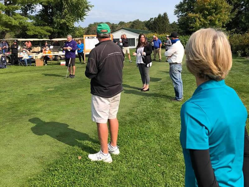 People watching the golf tournament.