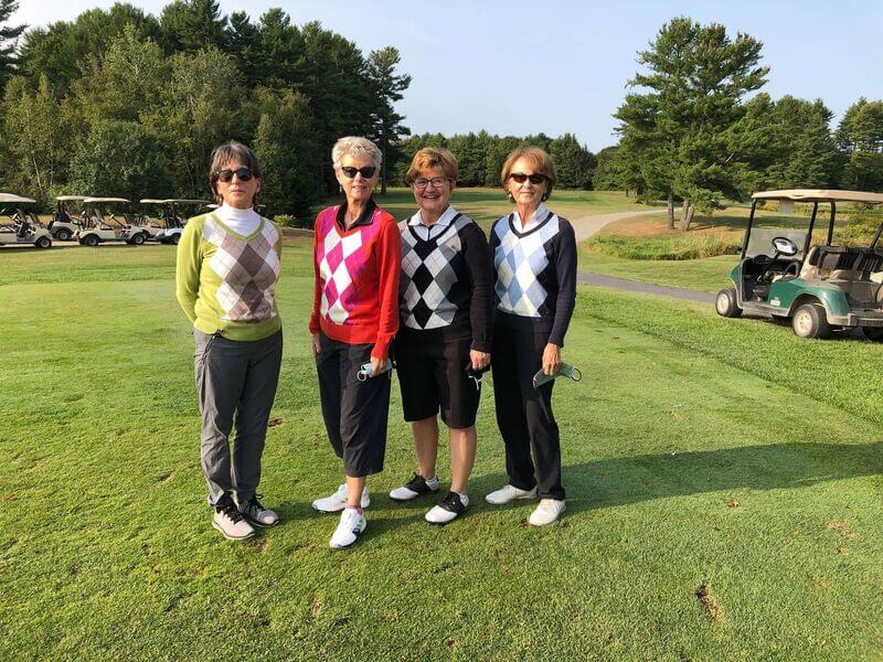 People attending the golf tournament.