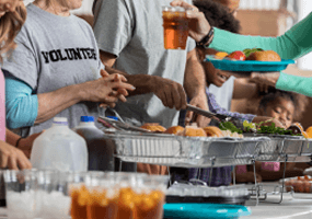 People helping a meal.